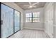 Bright sun room with wood-look ceiling, shiplap, and large window with backyard view at 38 Shadow Moss Pl. # 38, North Myrtle Beach, SC 29582