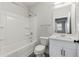 Clean bathroom with white vanity and shower/tub combo at 395 S Crow Creek Dr. # 1621, Calabash, NC 28467