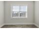 Bright bedroom with a large window and hardwood floors at 395 S Crow Creek Dr. # 1621, Calabash, NC 28467