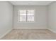 Simple bedroom with neutral walls and carpeted floor at 395 S Crow Creek Dr. # 1621, Calabash, NC 28467