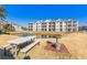 Community view with pond, picnic table, and grill at 395 S Crow Creek Dr. # 1621, Calabash, NC 28467