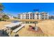 Community view showcasing building #1621 and picnic area at 395 S Crow Creek Dr. # 1621, Calabash, NC 28467
