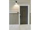 Modern apartment building front door entrance with sleek design at 395 S Crow Creek Dr. # 1621, Calabash, NC 28467