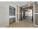 Apartment building hallway with elevator and exit at 395 S Crow Creek Dr. # 1621, Calabash, NC 28467