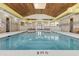 Indoor pool with high ceilings and natural light at 395 S Crow Creek Dr. # 1621, Calabash, NC 28467