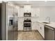 Stainless steel appliances and white shaker cabinets in kitchen at 395 S Crow Creek Dr. # 1621, Calabash, NC 28467