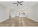 Open living room with wood-look floors and kitchen view at 395 S Crow Creek Dr. # 1621, Calabash, NC 28467