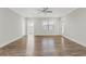 Spacious living room with wood-look floors and access to balcony at 395 S Crow Creek Dr. # 1621, Calabash, NC 28467
