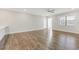 Living room with wood-look floors and kitchen at 395 S Crow Creek Dr. # 1621, Calabash, NC 28467