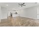 Open living room features wood-look floors and a modern kitchen at 395 S Crow Creek Dr. # 1621, Calabash, NC 28467