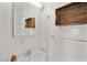 Small bathroom with sink, mirror, and tiled walls at 408 16Th Ave. S, Myrtle Beach, SC 29577