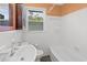 Clean bathroom with white tile and a bathtub at 408 16Th Ave. S, Myrtle Beach, SC 29577