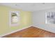 Simple bedroom with hardwood floors and a view of the backyard at 408 16Th Ave. S, Myrtle Beach, SC 29577