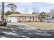 Brick ranch house with attached garage and yard at 408 16Th Ave. S, Myrtle Beach, SC 29577
