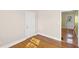 Cozy spare bedroom with hardwood floors and access to exterior at 408 16Th Ave. S, Myrtle Beach, SC 29577