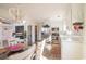 Bright and airy kitchen with white cabinets, stainless steel appliances, and a chandelier at 467 Harrelson Rd., Georgetown, SC 29440