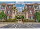 Brick building with palm trees and parking lot at 500 River Oaks Dr. # 58-O, Myrtle Beach, SC 29579