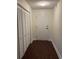 Condo entryway with dark wood floors and built-in storage at 5001 Little River Rd. # E-110, Myrtle Beach, SC 29577