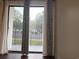 View of the parking lot from inside the condo through sliding glass doors at 5001 Little River Rd. # E-110, Myrtle Beach, SC 29577