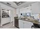 White kitchen with stainless steel appliances and granite counters at 501 Maison Dr. # F12, Myrtle Beach, SC 29572