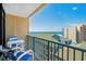 Enjoy ocean view from condo balcony with comfortable seating and railing, perfect for relaxing at 501 S Ocean Blvd. # 708, North Myrtle Beach, SC 29582