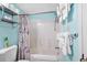 Practical bathroom features a shower with a shower curtain, a toilet, and towels at 501 S Ocean Blvd. # 708, North Myrtle Beach, SC 29582