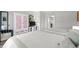 Comfortable bedroom with two beds, pastel accents, and a view to the kitchenette at 501 S Ocean Blvd. # 708, North Myrtle Beach, SC 29582