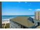 Scenic ocean view from condo featuring blue skies and rooftop views of the beach at 501 S Ocean Blvd. # 708, North Myrtle Beach, SC 29582