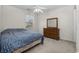 Bedroom with a full-size bed and built-in dresser at 5060 Windsor Green Way # 203, Myrtle Beach, SC 29579