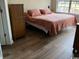 King-size bedroom with hardwood floors and ample closet space at 5060 Windsor Green Way # 203, Myrtle Beach, SC 29579