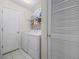 Laundry room with washer, dryer, and shelving at 5060 Windsor Green Way # 203, Myrtle Beach, SC 29579
