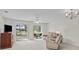 Living room with sliding doors leading to balcony at 5060 Windsor Green Way # 203, Myrtle Beach, SC 29579