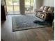 Spacious living room featuring hardwood floors and access to a balcony at 5060 Windsor Green Way # 203, Myrtle Beach, SC 29579