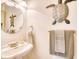 Small bathroom with pedestal sink and decorative accents at 508 5Th Ave. S, North Myrtle Beach, SC 29582