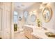 Bathroom boasts dual vanities, oval mirrors, and a tiled floor at 508 5Th Ave. S, North Myrtle Beach, SC 29582