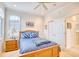 Bright bedroom featuring a double bed, built-in wardrobe, and window at 508 5Th Ave. S, North Myrtle Beach, SC 29582