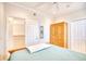 Light and airy bedroom with a built-in wooden wardrobe and ample closet space at 508 5Th Ave. S, North Myrtle Beach, SC 29582