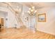 Spacious dining room with hardwood floors, chandelier, and staircase view at 508 5Th Ave. S, North Myrtle Beach, SC 29582