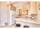 Kitchen features light wood cabinets, white appliances, and a breakfast bar at 508 5Th Ave. S, North Myrtle Beach, SC 29582