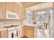 Bright kitchen with island, light wood cabinets, and eat-in area at 508 5Th Ave. S, North Myrtle Beach, SC 29582