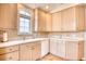 Corner kitchen with light wood cabinets, white appliances, and tile flooring at 508 5Th Ave. S, North Myrtle Beach, SC 29582