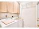 Laundry room with washer, dryer, and overhead cabinets at 508 5Th Ave. S, North Myrtle Beach, SC 29582