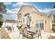 Large patio with brick house, seating area, and grill at 508 5Th Ave. S, North Myrtle Beach, SC 29582