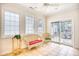 Bright sunroom with tiled floor, wicker furniture, and sliding glass doors leading to patio at 508 5Th Ave. S, North Myrtle Beach, SC 29582