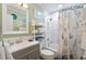 Clean bathroom with shower/tub combo, vanity, and beach-themed decor at 600 S Ocean Blvd. # C-21, North Myrtle Beach, SC 29582