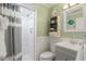 Bathroom with shower stall, vanity, and gray striped shower curtain at 600 S Ocean Blvd. # C-21, North Myrtle Beach, SC 29582