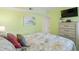 Bedroom with coastal bedding, dresser, and TV at 600 S Ocean Blvd. # C-21, North Myrtle Beach, SC 29582