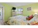 Bright bedroom with a dresser, TV and coastal decor at 600 S Ocean Blvd. # C-21, North Myrtle Beach, SC 29582