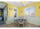 Small dining area with white table and chairs, near kitchen at 600 S Ocean Blvd. # C-21, North Myrtle Beach, SC 29582