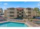 Tan building exterior with balconies and pool view at 600 S Ocean Blvd. # C-21, North Myrtle Beach, SC 29582